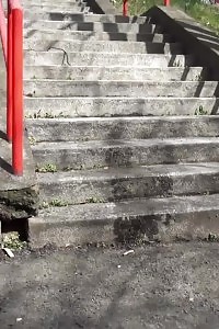 Brunette Doll Pisses On Concrete Steps