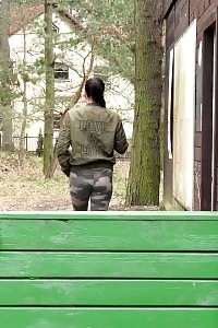 Lovely Dame Pisses Onto A Wooden Terrace