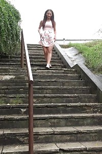 Black-haired Pissing In Public Over Concrete Steps