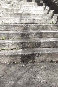 Brunette Doll Pisses On Concrete Steps