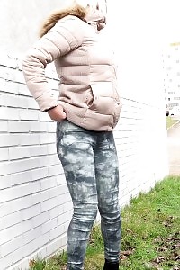 Light-haired Keeps A Lookout As She Pisses Outside