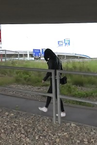 Kinky Black Haired Doll In Glasses Pissing Outside