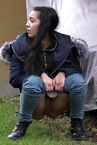 Black Haired European Squats To Piss In Public