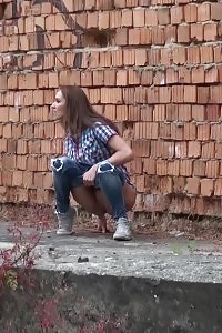 Slim Brunette Pisses In An Alleyway