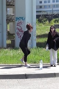 Enticing Black-haired Pisses Next To A Parked Van