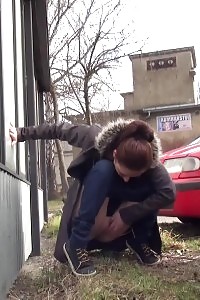 Outstanding Brunette Doll Pisses Behind A Schoolbus Stop