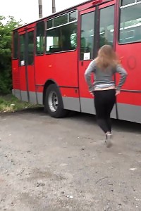 Big-breasted Brunette Taking A Leek Behind A Bus