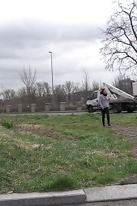 Brunette Lady Pisses By A Public Car Park