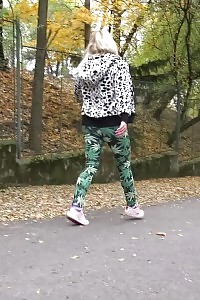 Flexible Blonde In Pants Pisses On The Ground