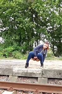 Bootylicious Brunette Pisses Over The Train Tracks