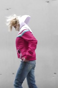 Blonde In Jeans Denim Pisses Outdoor In The Wind