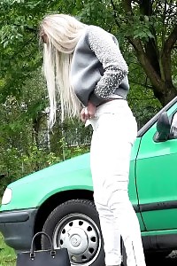Blonde Girl Pisses Next To A Parked Car