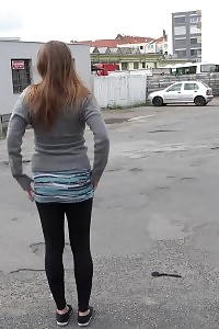 Big-breasted Brunette Taking A Leek Behind A Bus