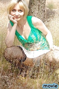 Alluring Kirsty Blue Reveals Her Sexy Nylons Outdoors As She Poses In The Grassfield