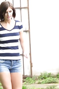 Seductive Black-haired Pissing Over A Path While Outdoors