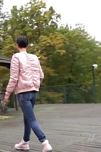 Black Haired Doll Squats To Piss On Decking