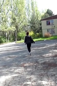 Black-haired Doll Pisses Down Some Concrete Steps