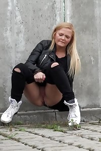 Appealing Blonde Squats Outside To Piss In The City