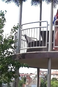 Magnificent Ginger Pisses Over Her Balcony
