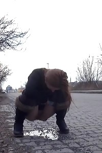 Lovely Ginger Is Caught Twice Peeing In Public