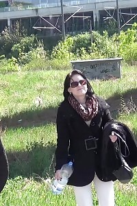 Enticing Black-haired Pisses Next To A Parked Van