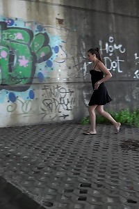 Inviting Brunette Pisses In The City On Drain Pipe