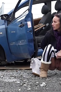 Eveline Squats Behind An Abandoned Vehicle To Pee