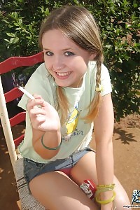 Next Door Kitty Burning A Cigarette And Displays Her Panties