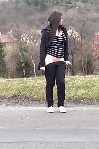 Strong Brunette Pisses In The Mid Of The City