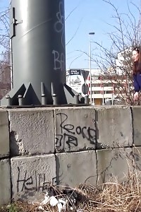 Black-haired With Long Hair Pisses In Public View