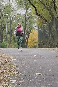 Flexible Blonde In Pants Pisses On The Ground