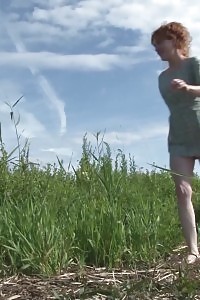 Ginger Honey Pees Over A Huge Rock Outside