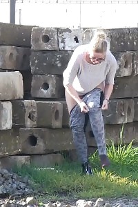 Magnificent Blonde In Specs Pisses Next To Railway