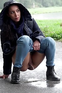 Impressive Black Haired Girl Pees On The Ground