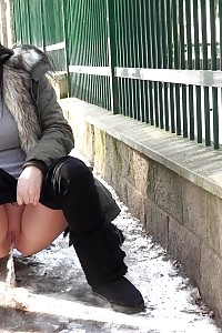 Captivating Black Haired Chick Pisses On The Snow