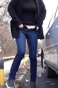 Brunette Slut Squats Near A Car To Pee Outside