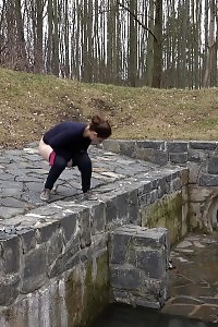 Antonia Pissing Outside Next To Drainage Pipe