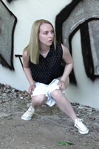 Blonde Showstopper Squats And Pisses Outside Near A Wall