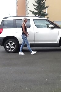 Blonde Pisses Next To A Parked Car