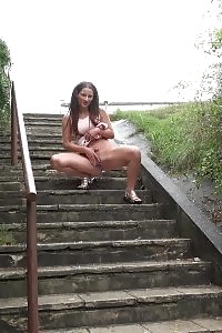 Black-haired Pissing In Public Over Concrete Steps