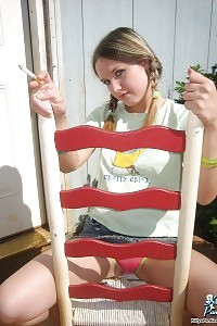 Next Door Kitty Burning A Cigarette And Displays Her Panties
