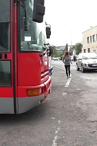 Big-breasted Brunette Taking A Leek Behind A Bus