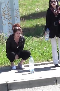 Enticing Black-haired Pisses Next To A Parked Van
