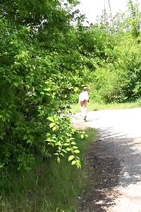 Black Haired Esperansa Squats In A Field To Piss