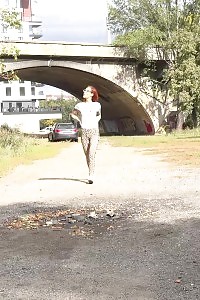 Good-looking Ginger In Leopard Print Taking A Leek Outside