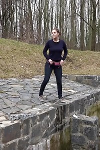 Antonia Pissing Outside Next To Drainage Pipe