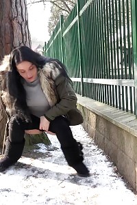 Captivating Black Haired Chick Pisses On The Snow