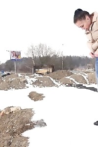 Magnificent Girl Squats In The Snow And Pisses Outside