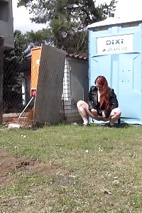 Redheaded Bombshell Needs To Pee Near A Building Site