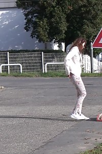 Brunette Gal Makes A Pissy Puddle On The Road